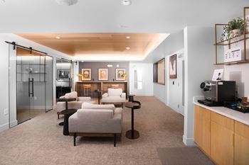 Collaborative co-working space with private alcoves and a coffee bar